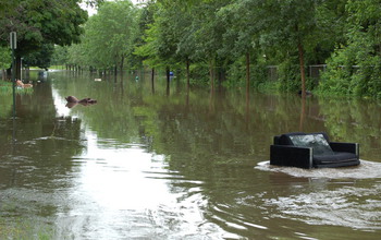furniture floating on a flooded street